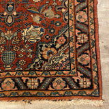 small red rug with center medallion