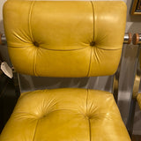 pair of chrome and yellow counter stools