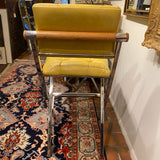 pair of chrome and yellow counter stools