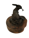 Bronze rabbit sculpture on wood base signed Lowell Davis