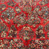 1930's Sarouk floral rug with red field  7'7" x 9'7"