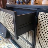 Crate and Barrel black caned chest of 3 drawers and 1 door