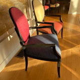 Set of 8 Roche Bobois dining chairs with black frames and multi color upholstery