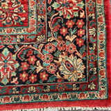 1930's Sarouk floral rug with red field  7'7" x 9'7"