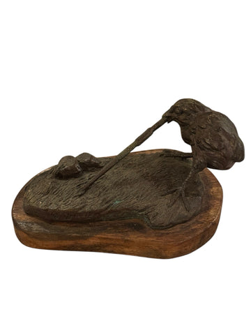 Bronze bird with worm sculpture on wood base signed Lowell Davis