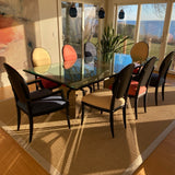 Set of 2 Roche Bobois dining chairs with black frames and multi color upholstery