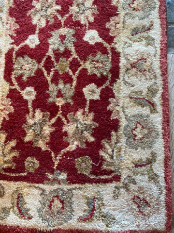 Small Red And Ivory Floral Rug