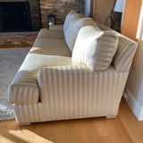 Two toned beige striped upholstered couch