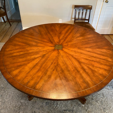 Beautiful Regency style round wood pedestal table with brass detail