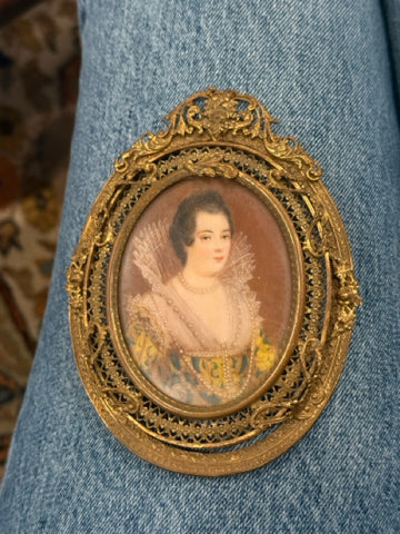 Handpainted femaile portrait in oval filigree frame