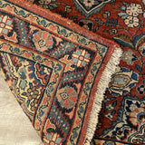 small red rug with center medallion