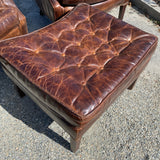 Pair of Restoration Hardware leather tufted highback arm chairs with ottoman