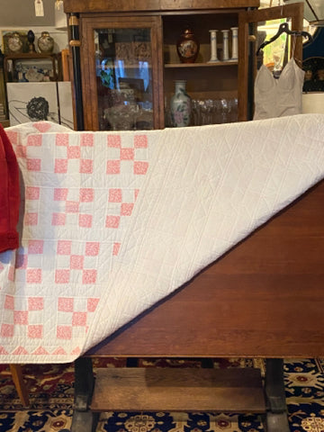 pink and white quilt