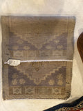 small hand woven flat weave nuetral colored throw rug