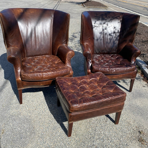 Pair of Restoration Hardware leather tufted highback arm chairs with ottoman