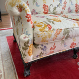 Camel back sofa custom upholstered in silk floral fabric and down cushions