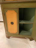 green and yellow corner cabinet