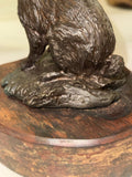 Bronze rabbit sculpture on wood base signed Lowell Davis
