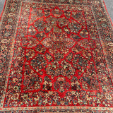 1930's Sarouk floral rug with red field  7'7" x 9'7"