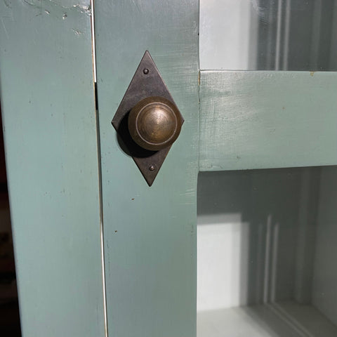 Tall green glass front cabinet