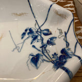blue and white serving dish with gold accent