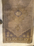 small hand woven flat weave nuetral colored throw rug