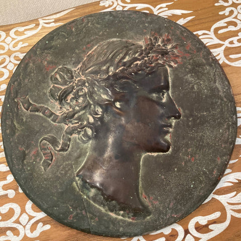 bronze portrait relief