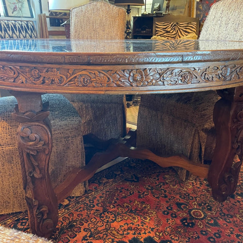 carved Indian teak table with glass top
