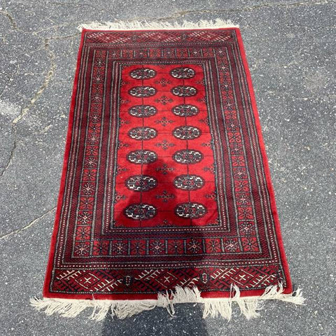 Traditional Red Rug with Fringe Detail