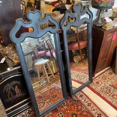 pair of black framed mirrors