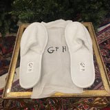 GP white slippers with GPH initials in black